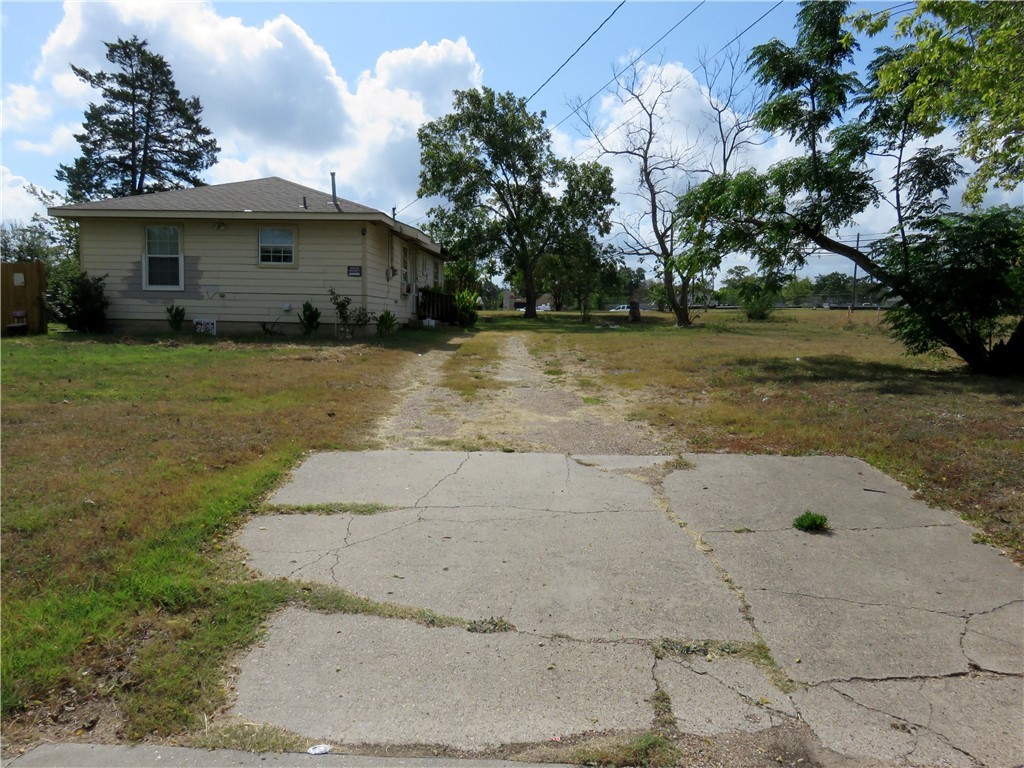 1413 Sandy Point Road Bryan, TX 77803 - Photo 15 of 22 a view of a house with a yard