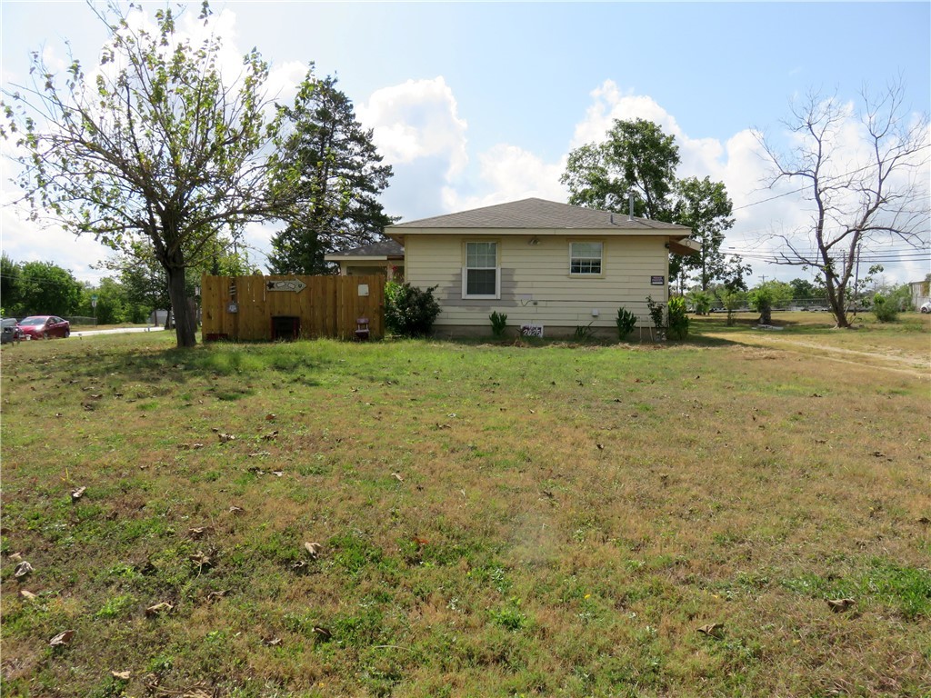 1413 Sandy Point Road Bryan, TX 77803 - Photo 3 of 22 a view of a house with a yard