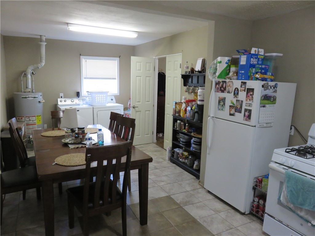 1413 Sandy Point Road Bryan, TX 77803 - Photo 7 of 22 a view of a dining room with furniture and a window