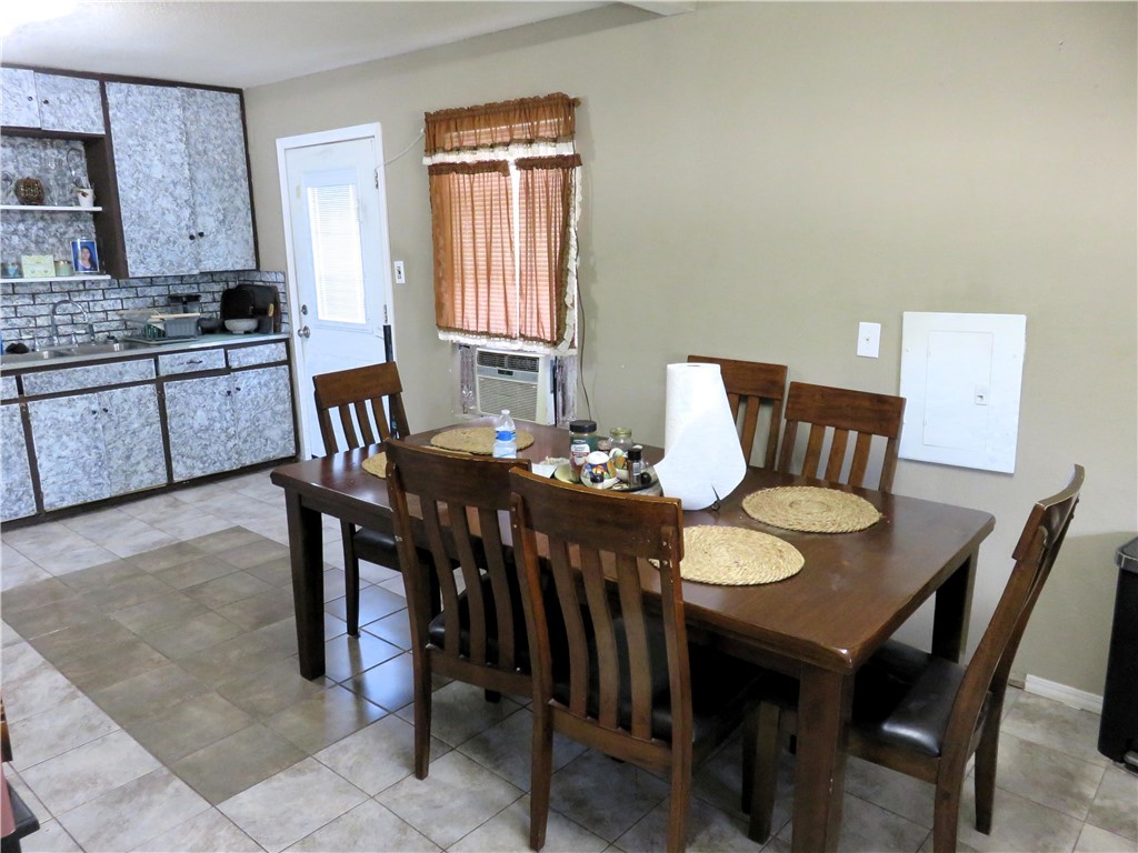1413 Sandy Point Road Bryan, TX 77803 - Photo 8 of 22 a view of a dining room with furniture