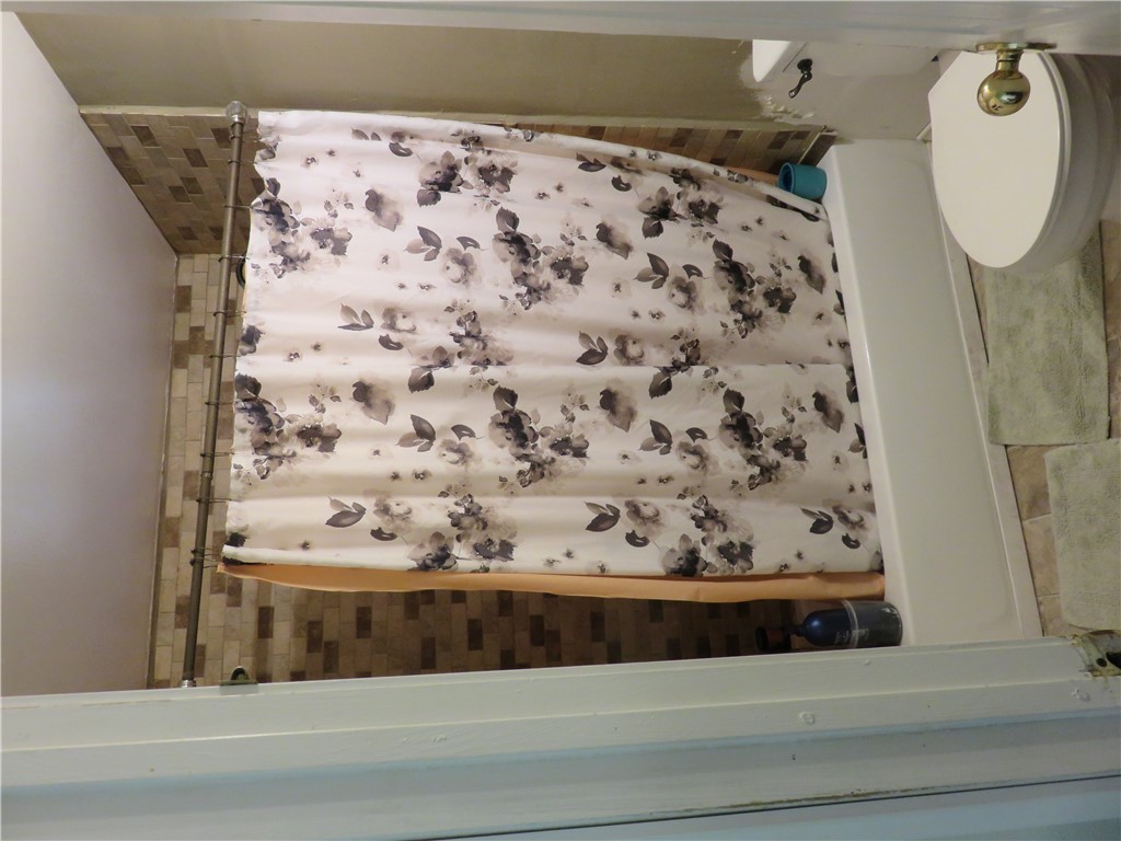 1413 Sandy Point Road Bryan, TX 77803 - Photo 9 of 22 a bathroom with a shower and a toilet