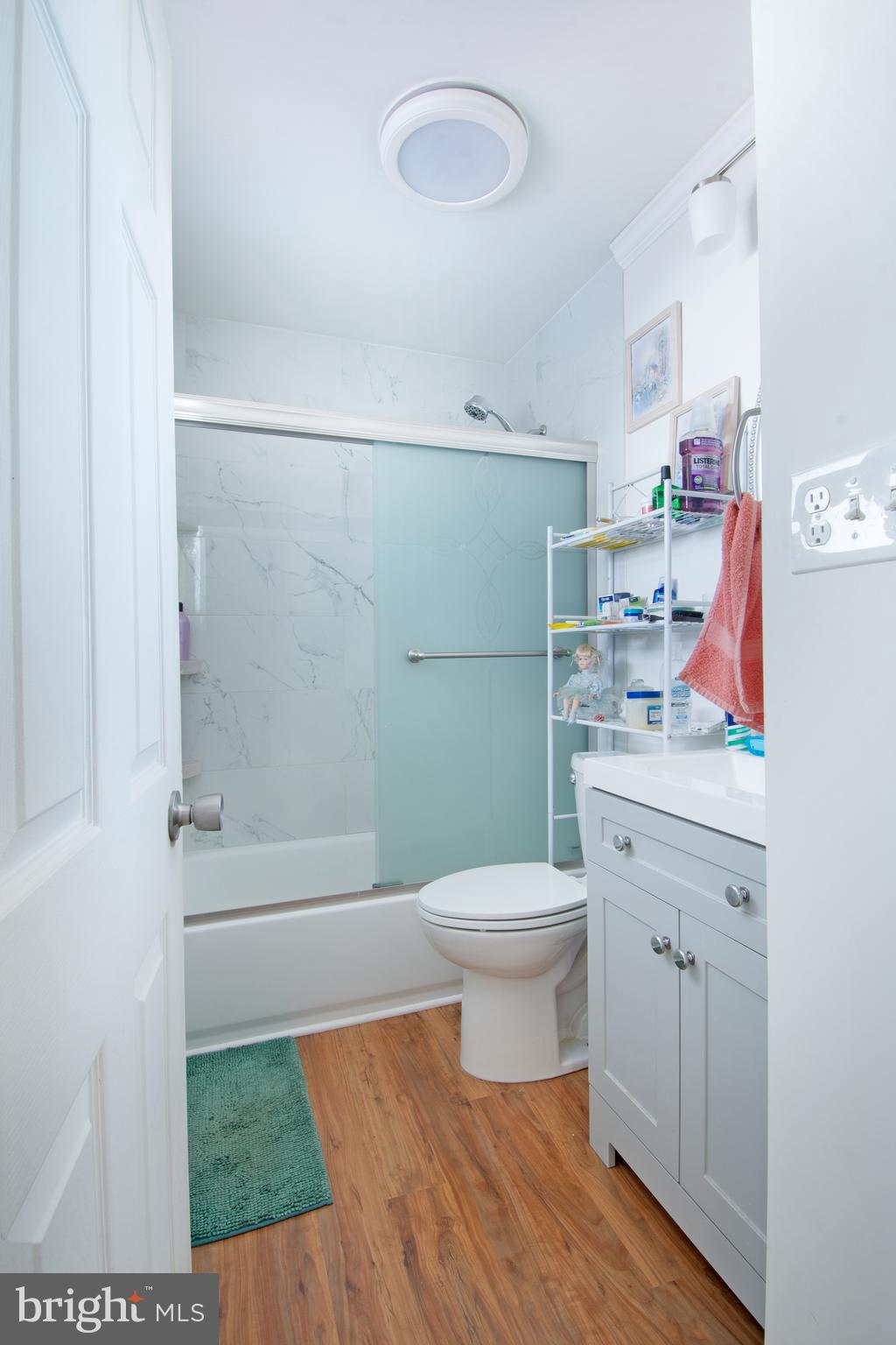 7 Gainor Road New Castle, DE 19720 - Photo 11 of 27 a bathroom with a sink a toilet and shower