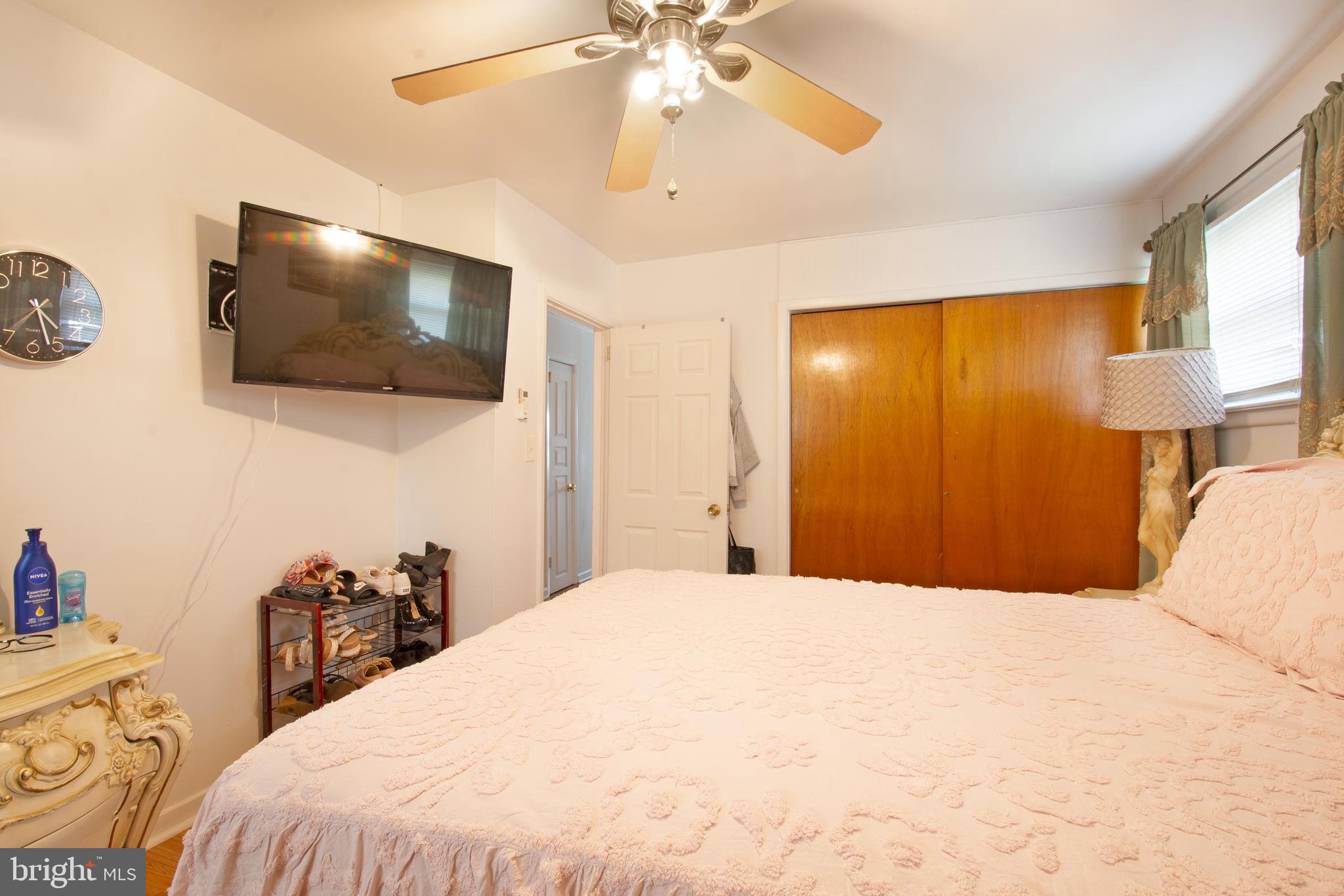 7 Gainor Road New Castle, DE 19720 - Photo 13 of 27 a bedroom with a bed and a flat screen tv