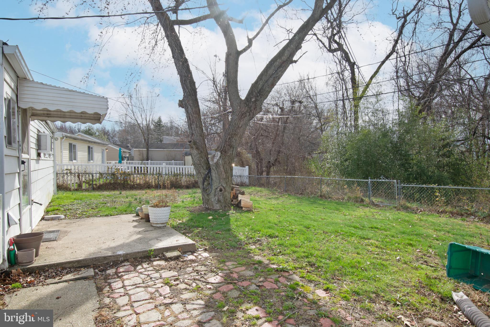 7 Gainor Road New Castle, DE 19720 - Photo 22 of 27 a view of a backyard with large trees