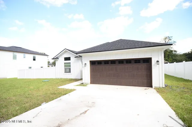a kitchen with a sink a refrigerator and a stove
