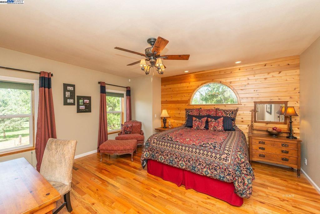 100 Eleanore Lane Trinity Center, CA 96091 - Photo 2 of 12 a bedroom with a bed and wooden floor