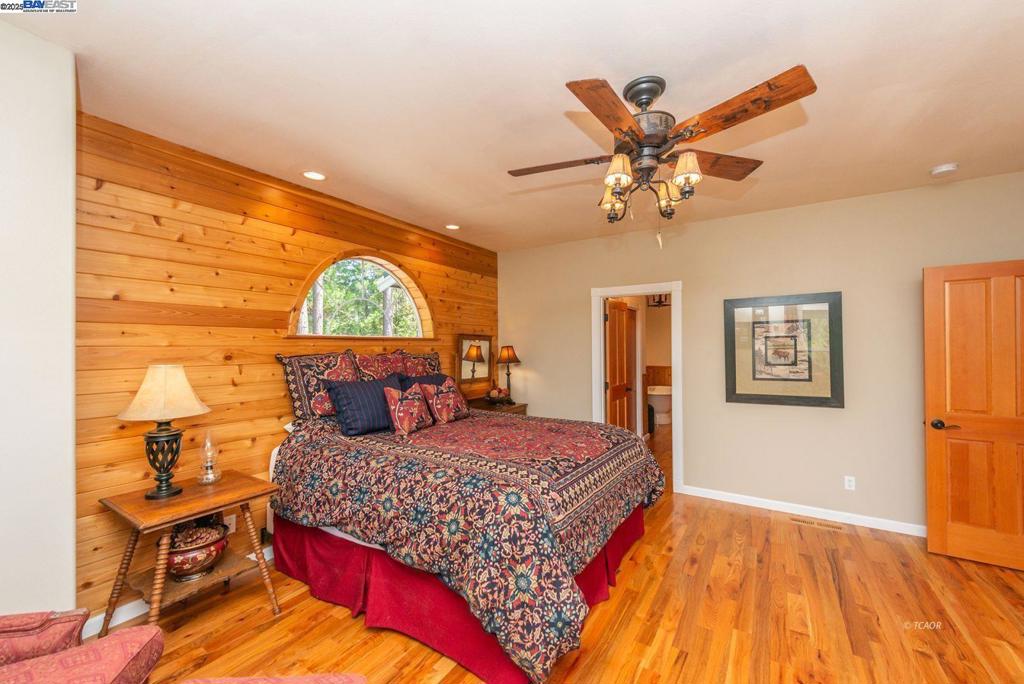 100 Eleanore Lane Trinity Center, CA 96091 - Photo 3 of 12 a bedroom with a bed and a table in it