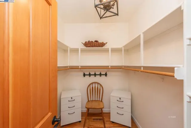 a bathroom with a granite countertop sink a toilet and bathtub