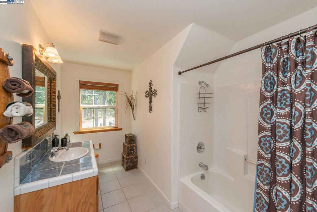 100 Eleanore Lane Trinity Center, CA 96091 - Photo 5 of 12 a bathroom with a granite countertop sink a toilet and bathtub