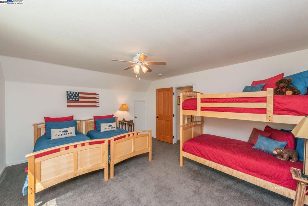 100 Eleanore Lane Trinity Center, CA 96091 - Photo 7 of 12 a bedroom with a bed and a chandelier