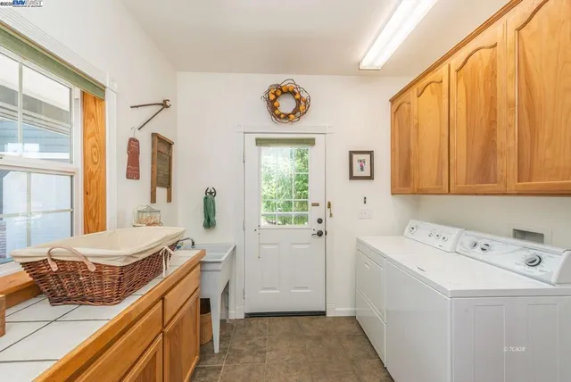 an aerial view of a house with a yard and garden