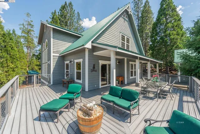 a view of a livingroom with furniture and a window