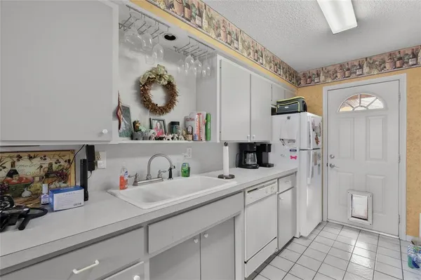 a kitchen with stainless steel appliances a sink and cabinets