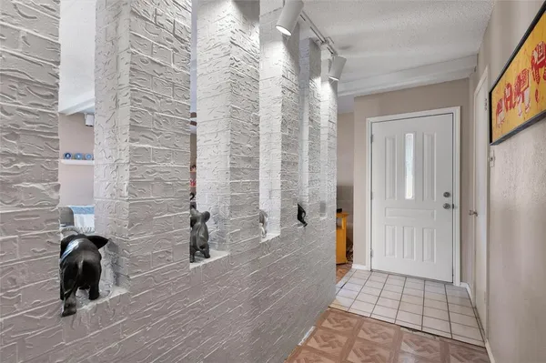 a view of a room with wooden floor and windows
