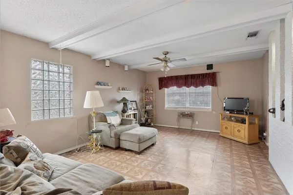 a spacious bedroom with a bed and window
