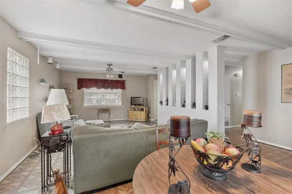 a living room with furniture and a window