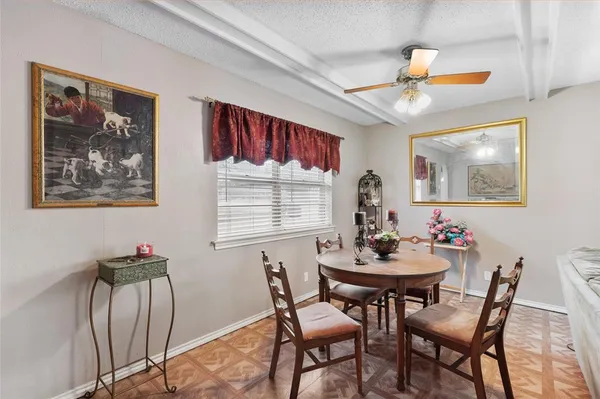a dining room with furniture and window