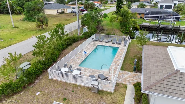 a view of a swimming pool with a patio