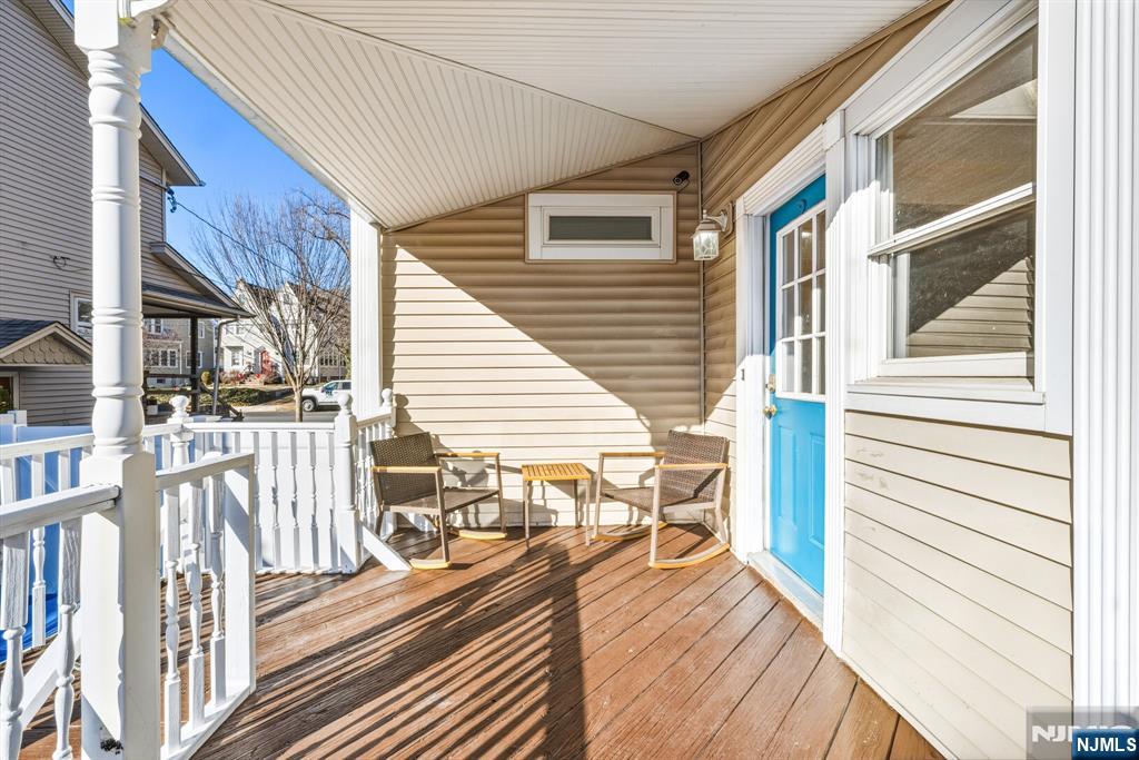 331 Mountain Way Rutherford, NJ 07070 - Photo 18 of 45 a balcony with wooden floors and furniture