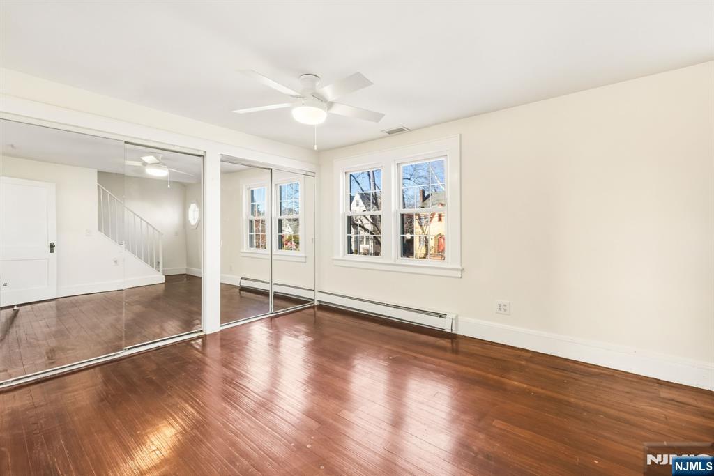 331 Mountain Way Rutherford, NJ 07070 - Photo 23 of 45 wooden floor in an empty room with a window