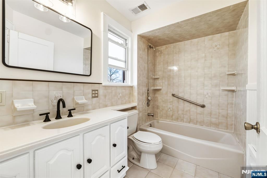 331 Mountain Way Rutherford, NJ 07070 - Photo 30 of 45 a bathroom with a sink a toilet and shower