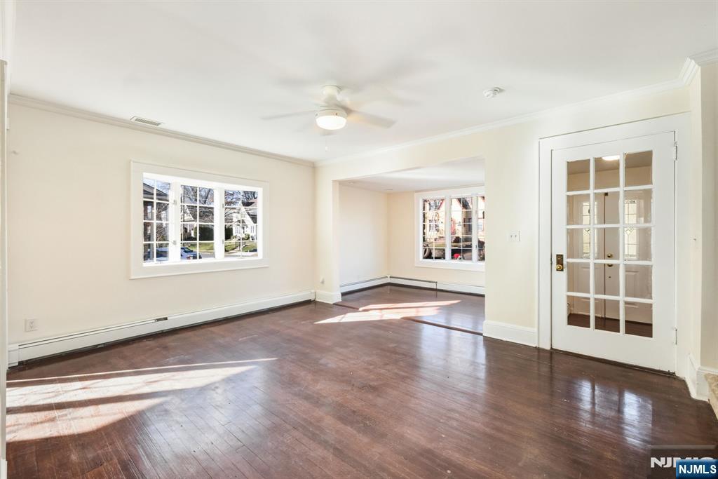 331 Mountain Way Rutherford, NJ 07070 - Photo 3 of 45 an empty room with wooden floor and windows