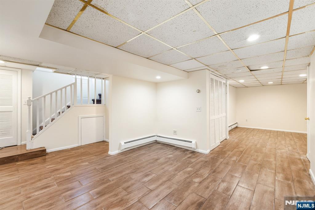 331 Mountain Way Rutherford, NJ 07070 - Photo 36 of 45 a view of an empty room with wooden floor
