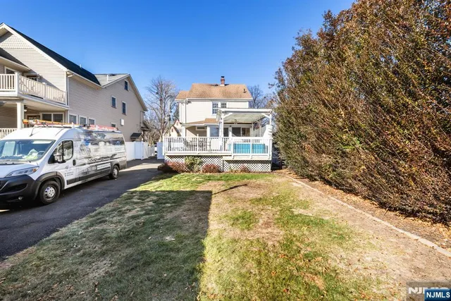 a view of multiple house with a yard