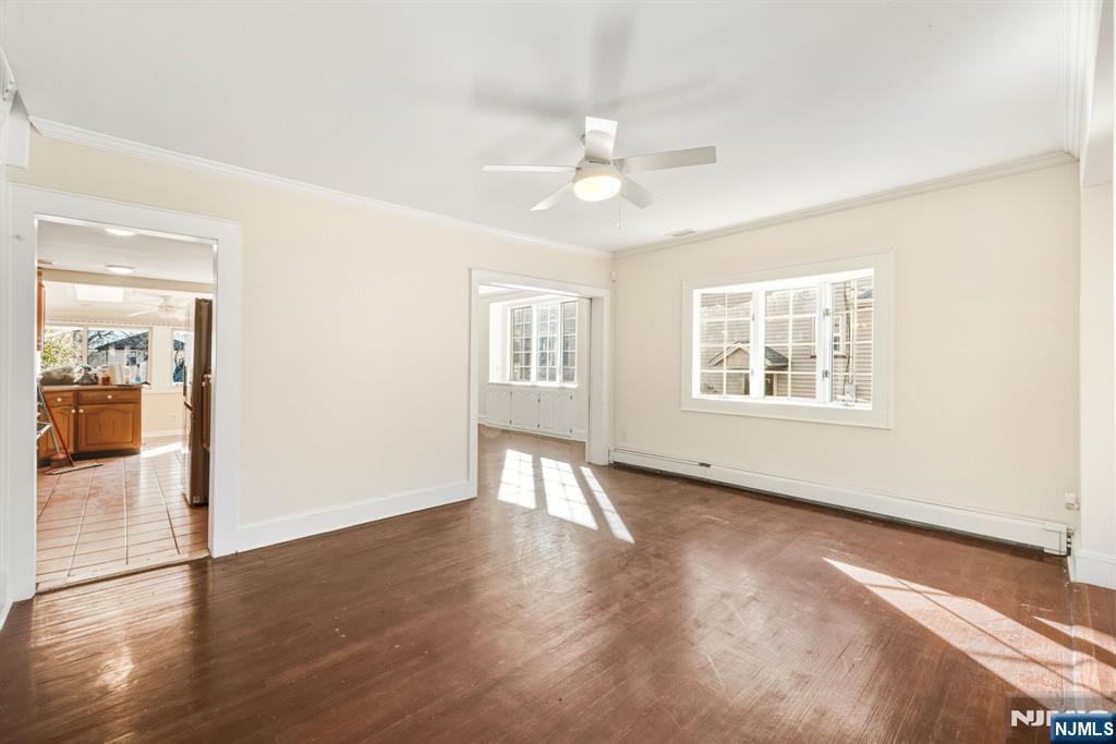 331 Mountain Way Rutherford, NJ 07070 - Photo 7 of 45 a view of an empty room with wooden floor and a window