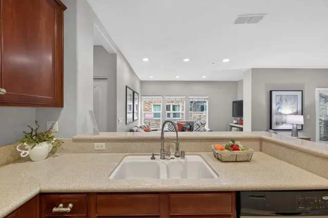 a kitchen with a stove and cabinets