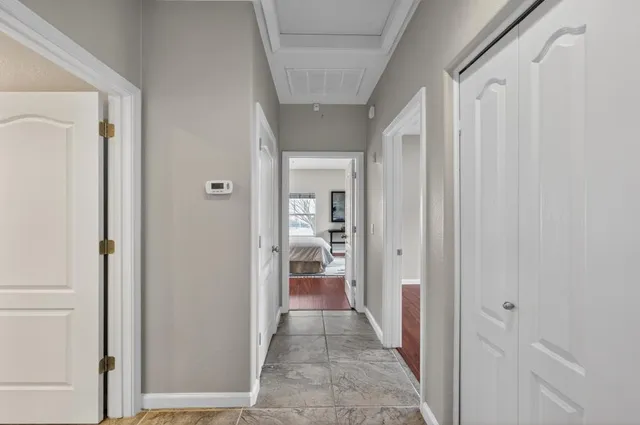 a bathroom with a sink vanity mirror and toilet