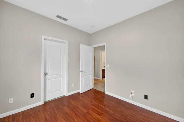 a bathroom with a toilet a sink and a large mirror