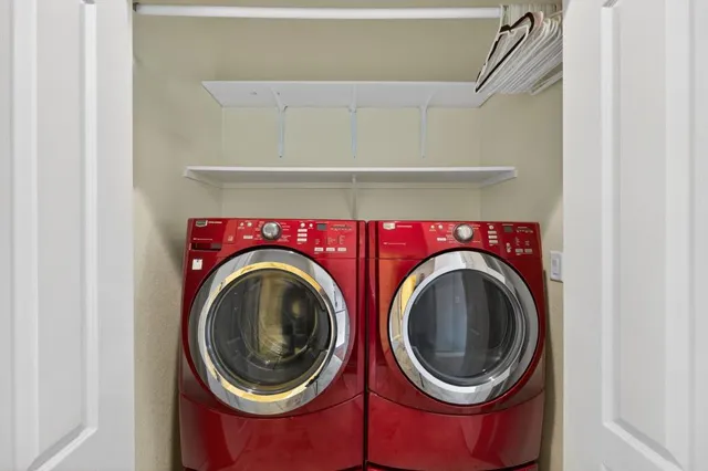 a view of a swimming pool with a patio and a yard