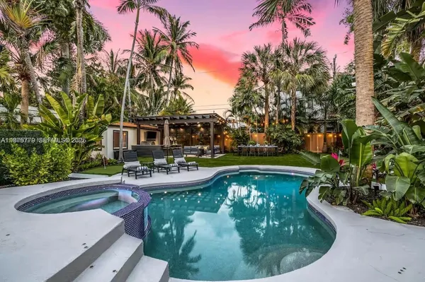 a view of a swimming pool with a patio