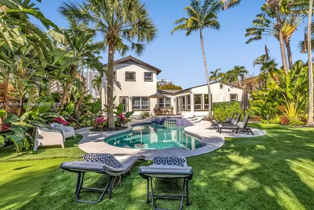 a outdoor living space with patio furniture and a fireplace
