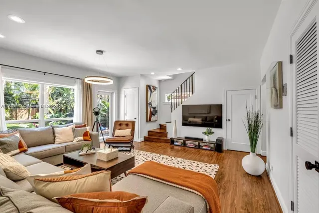 a living room with furniture and a flat screen tv