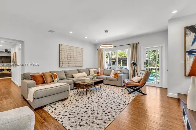 a living room with furniture rug and window