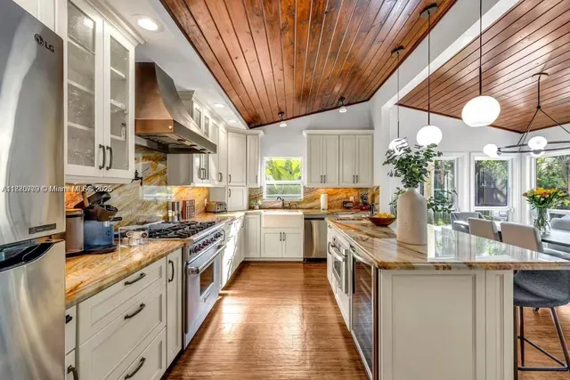 a kitchen with stainless steel appliances granite countertop lots of counter top space