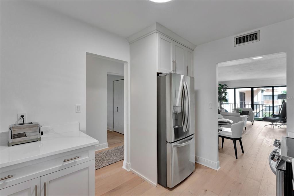 100 South Interlachen Avenue, Unit 410F Winter Park, FL 32789 - Photo 14 of 38 a kitchen with a refrigerator a stove and a sink