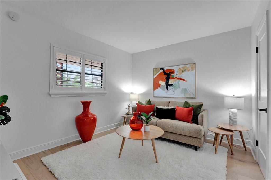 100 South Interlachen Avenue, Unit 410F Winter Park, FL 32789 - Photo 16 of 38 a living room with furniture a lamp and a window