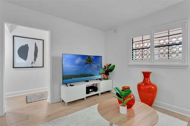 a room with toys and dresser with wooden floor