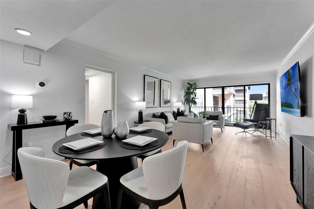 100 South Interlachen Avenue, Unit 410F Winter Park, FL 32789 - Photo 18 of 38 a view of a dining room with furniture and wooden floor