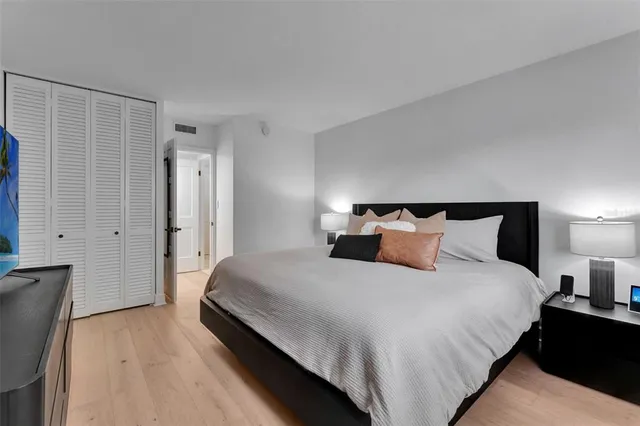 a bedroom with bed and window