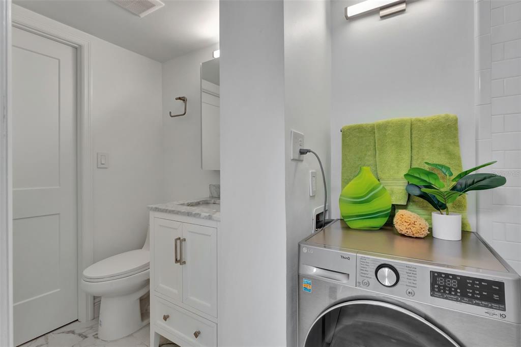 100 South Interlachen Avenue, Unit 410F Winter Park, FL 32789 - Photo 22 of 38 a view of washer and dryer