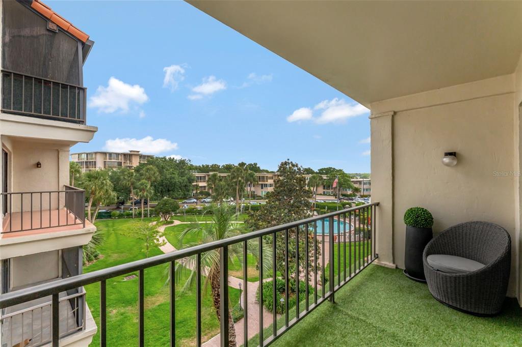 100 South Interlachen Avenue, Unit 410F Winter Park, FL 32789 - Photo 23 of 38 a view of a chair and tables front of the house