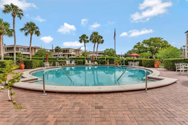 a view of a swimming pool with a lounge chairs