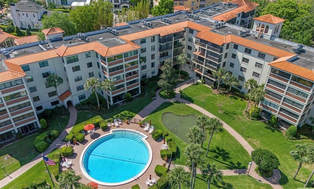100 South Interlachen Avenue, Unit 410F Winter Park, FL 32789 - Photo 27 of 38 aerial view of a house with a yard and plants