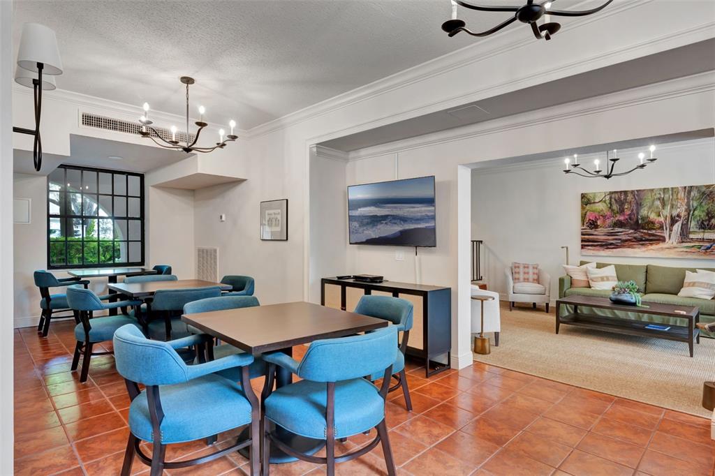 100 South Interlachen Avenue, Unit 410F Winter Park, FL 32789 - Photo 33 of 38 a view of a dining room with furniture window and wooden floor