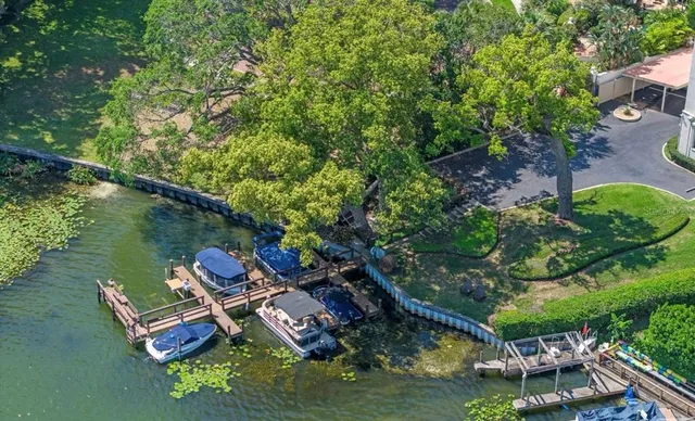 an aerial view of a house with outdoor space