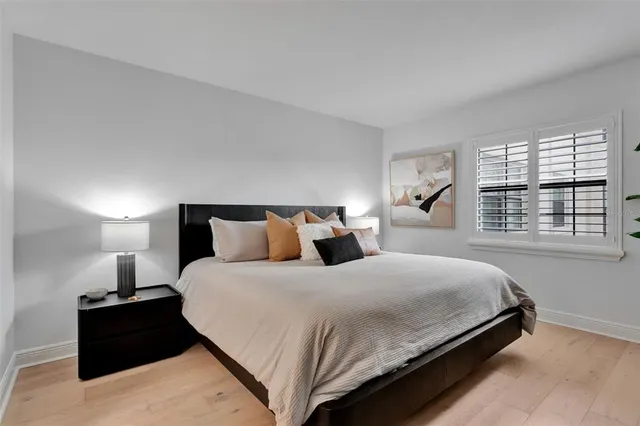 a bedroom with bed and window